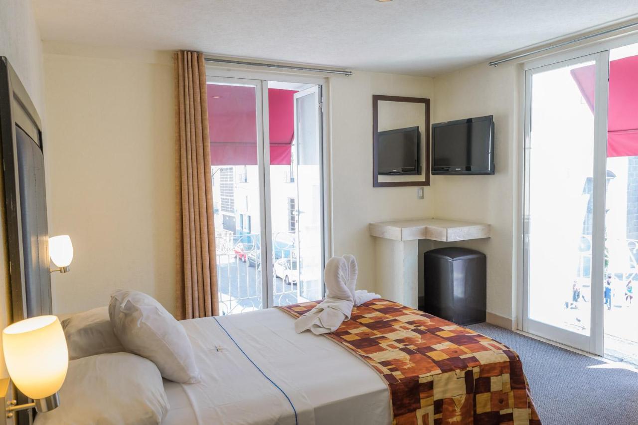 Hotel Posada Guadalupe ปวยบลา ภายนอก รูปภาพ