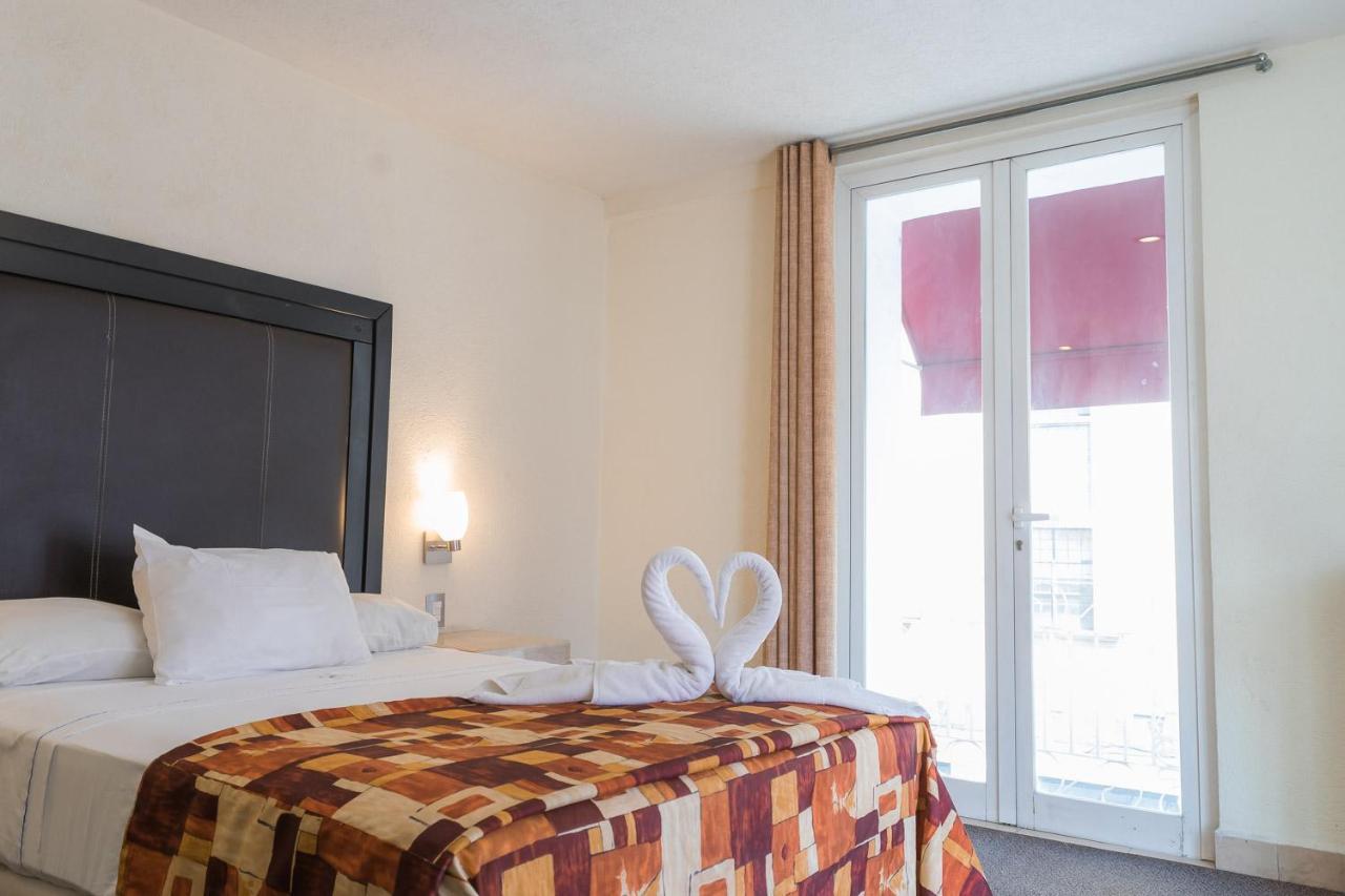 Hotel Posada Guadalupe ปวยบลา ภายนอก รูปภาพ